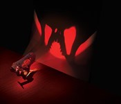 Настольный светильник Череп Тираннозавра с проекцией на стену Uncle Milton T-Rex In My Room